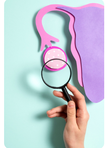 woman holding abdomen to depict pelvic pain from pcos and endometriosis