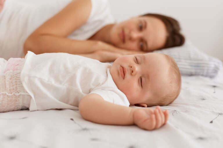 mother nursing her newborn baby during breastfeeding session