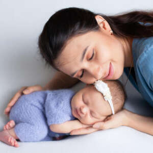 healthy newborn breastfeeding position with mother support