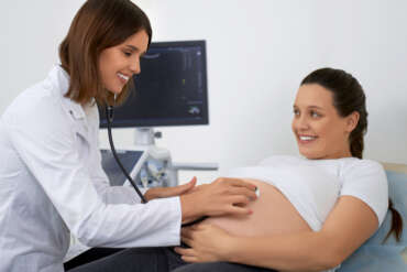 Doctor performing 20 week anomaly scan ultrasound during pregnancy